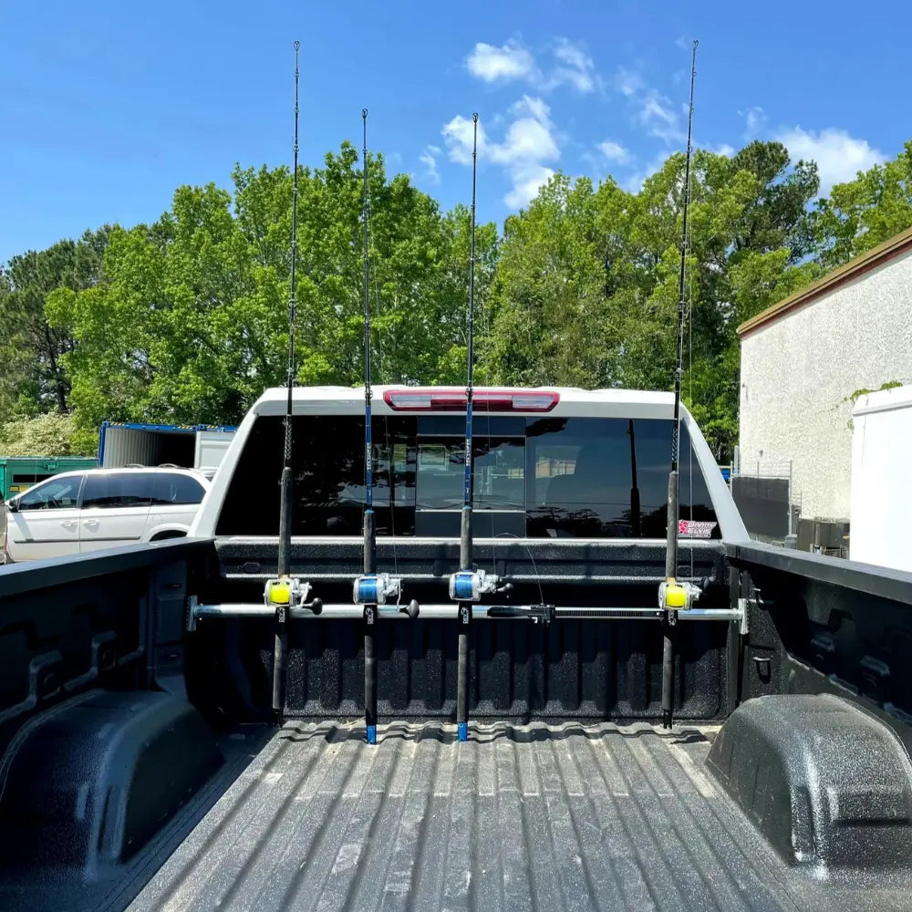 Custom made surf fishing rod holder for truck and cargo bed partition with  tie-down rings.